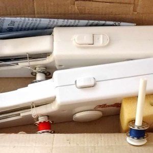 2 cordless battery operated sewing machines & accessories